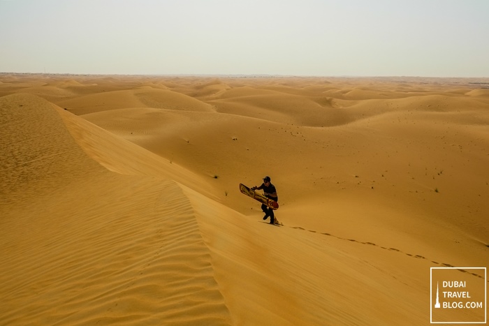 sandboarding-in-al-faqa-desert